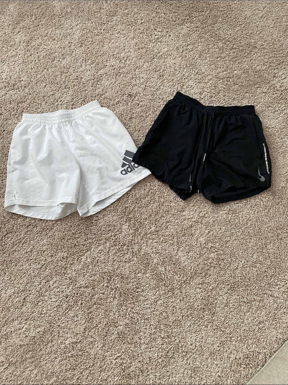 Two pairs adidas and Nike White and black Athletic Shorts with Logo